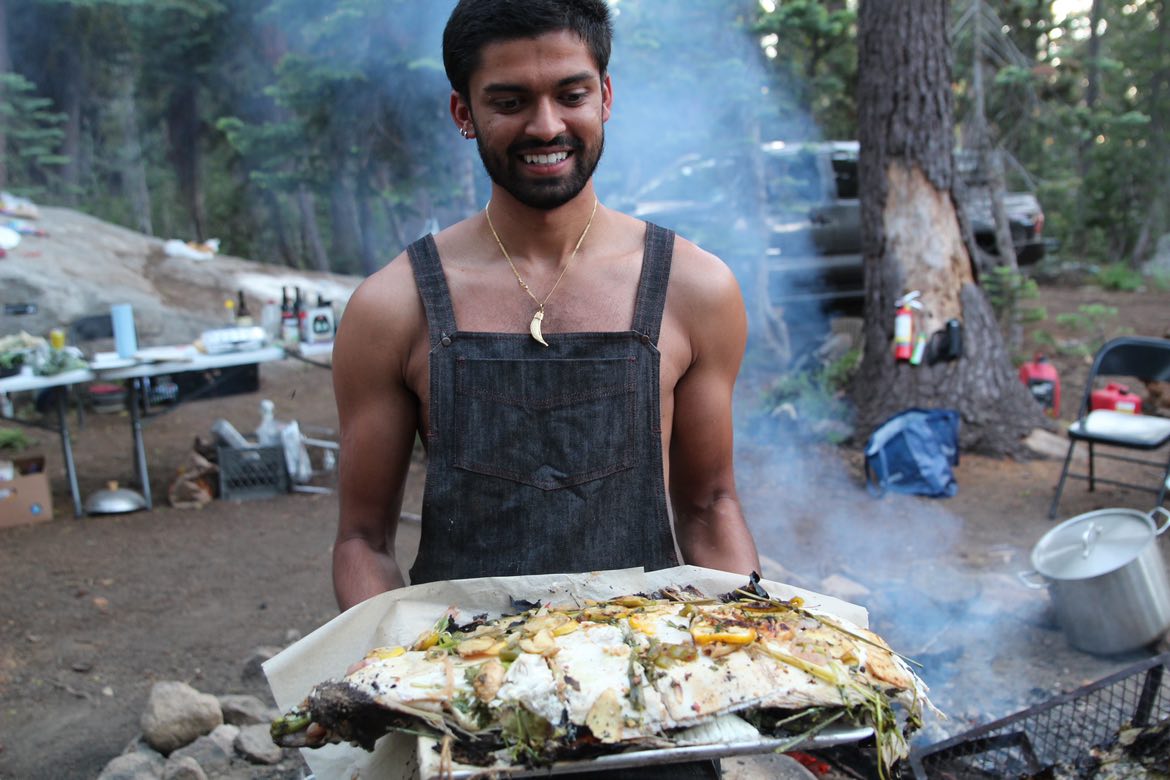 Whole fire-roasted fish at camp