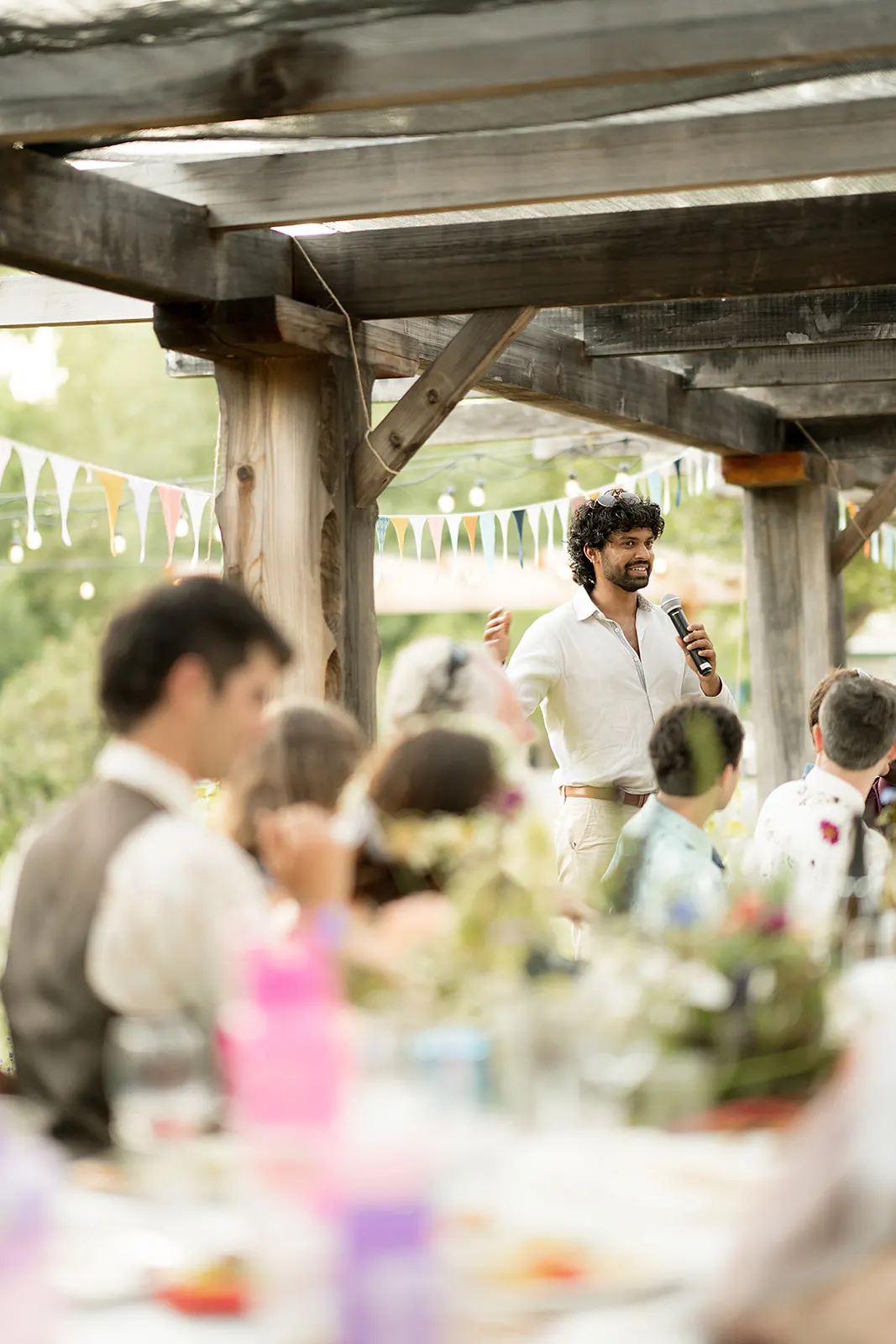 Akshay giving a toast at a wedding